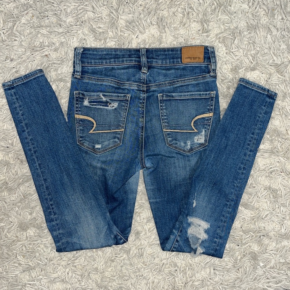 high waisted light blue ripped jeans from American Eagle outfitters size 0.